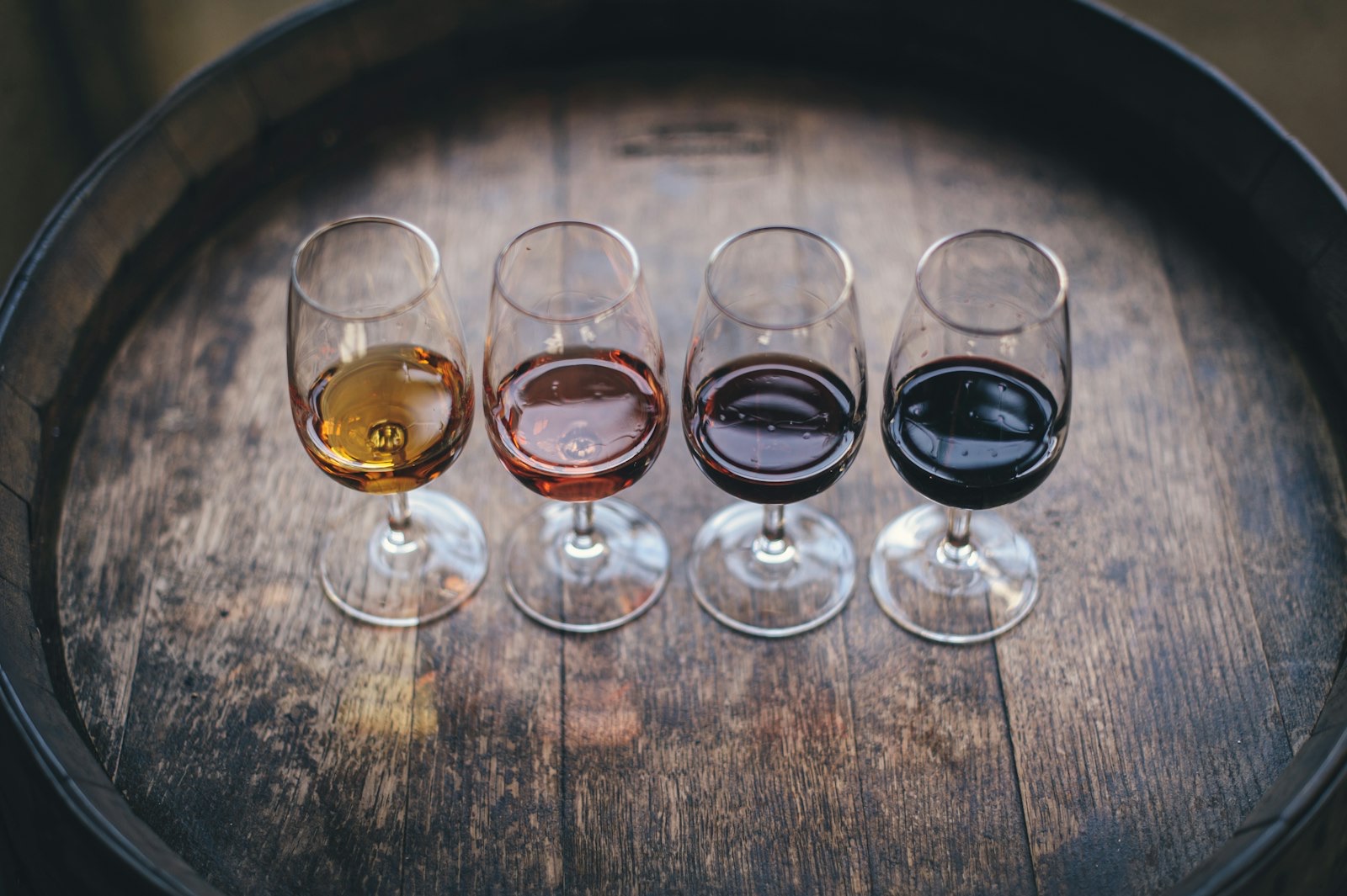 wine dropshipping Australia — a tasting flight of wines in a dark cellar
